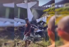 Resgate em Nova Iguaçu após queda de avião sobre residência.