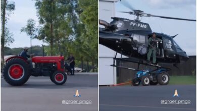Gusttavo Lima em trator ao lado de helicóptero da polícia em sua fazenda.