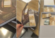 Dinheiro em espécie escondido dentro de um livro falso, apreendido pela PF.