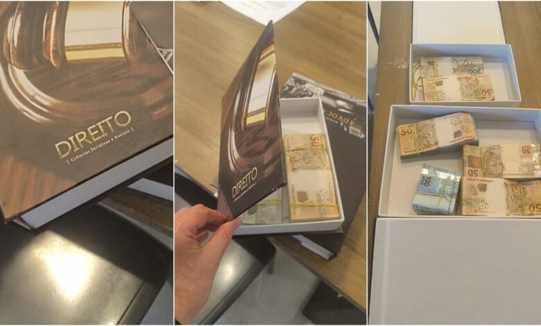 Dinheiro em espécie escondido dentro de um livro falso, apreendido pela PF.