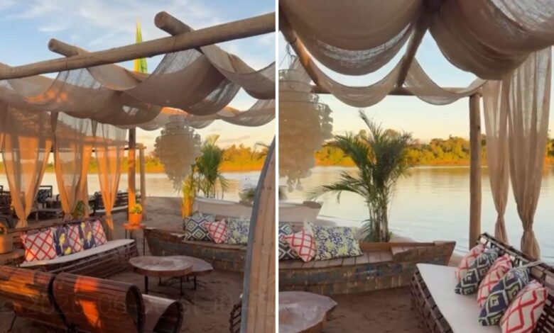 Vista do acampamento luxuoso no Rio Araguaia com bar de vinhos e palco para shows.