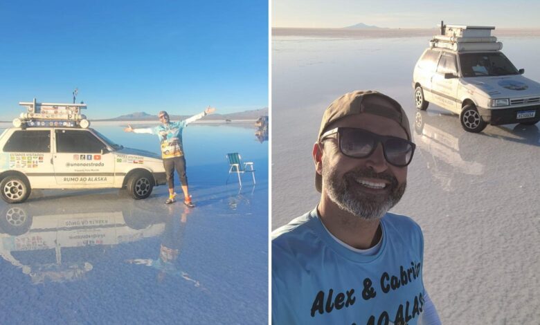Fiat Uno 1996 em viagem pelas Américas, com paisagens ao fundo.