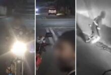 Caminhão de coleta de lixo em Goiânia em operação durante o dia.