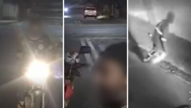 Caminhão de coleta de lixo em Goiânia em operação durante o dia.