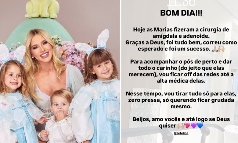 Virginia Fonseca segurando suas duas filhas pequenas em um ambiente hospitalar.
