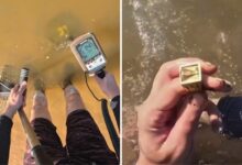 Mergulhador com detector de metal no Rio Araguaia.
