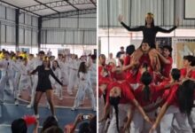 Estudantes em apresentação de dança em homenagem a Marília Mendonça.